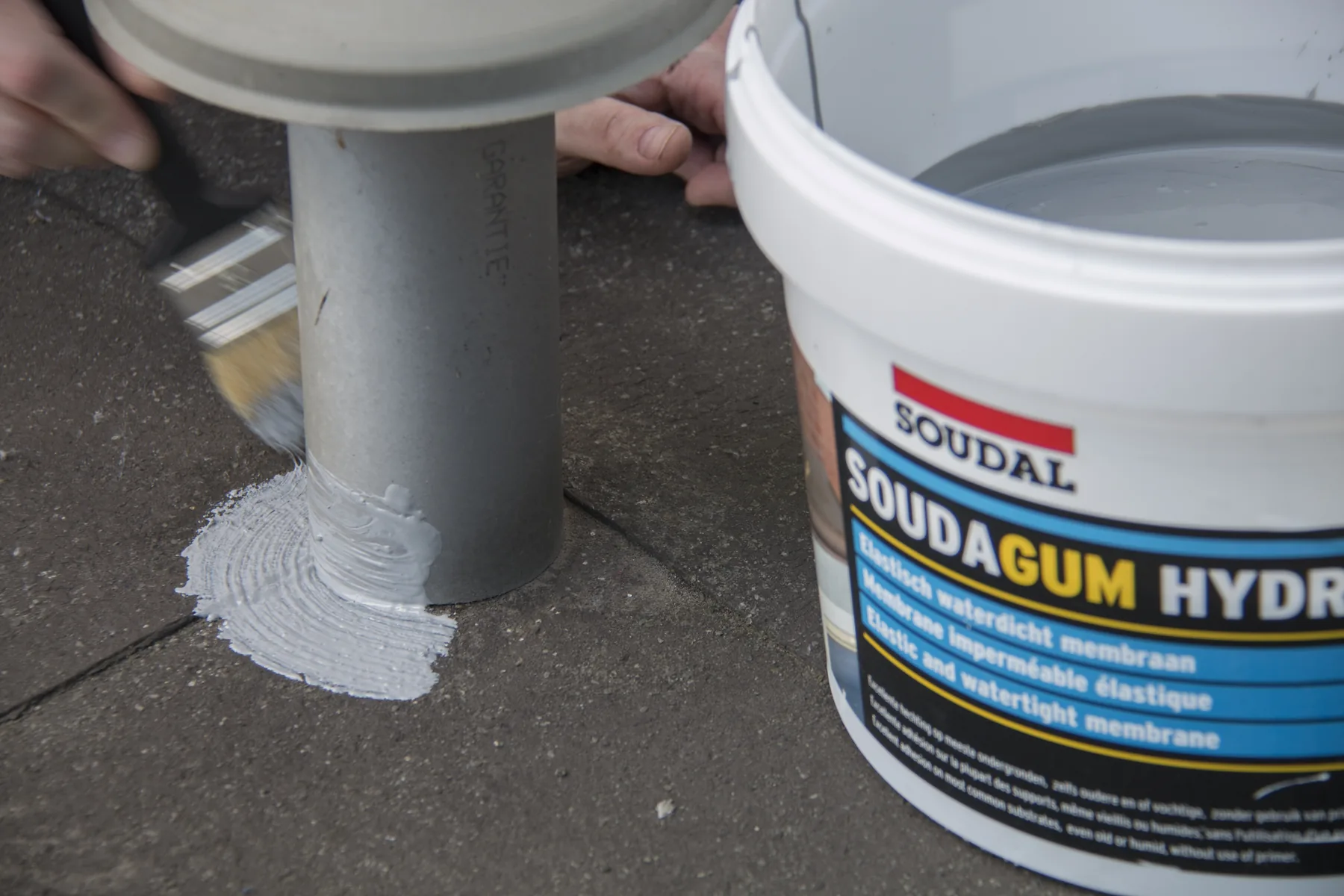 Applying Soudagum Hydro around a roof penetration