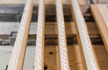 Applying adhesive beads to timber