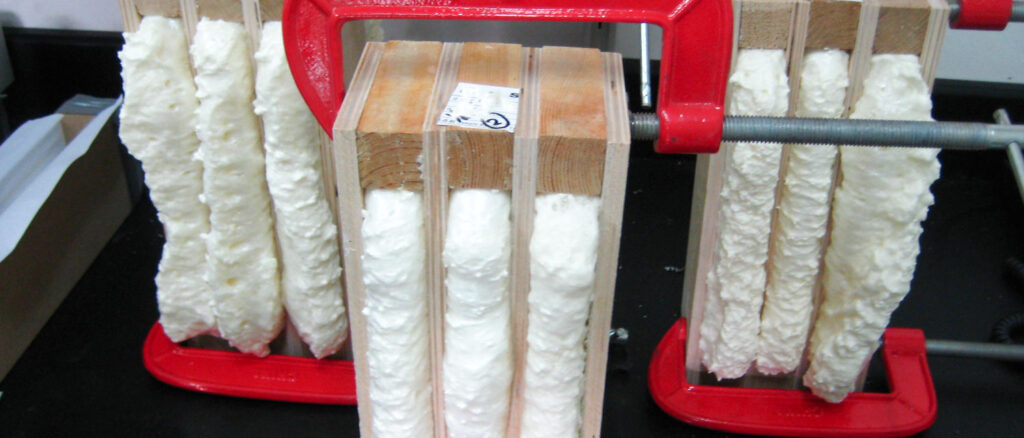 Expanding PU foam filling a prepared gap