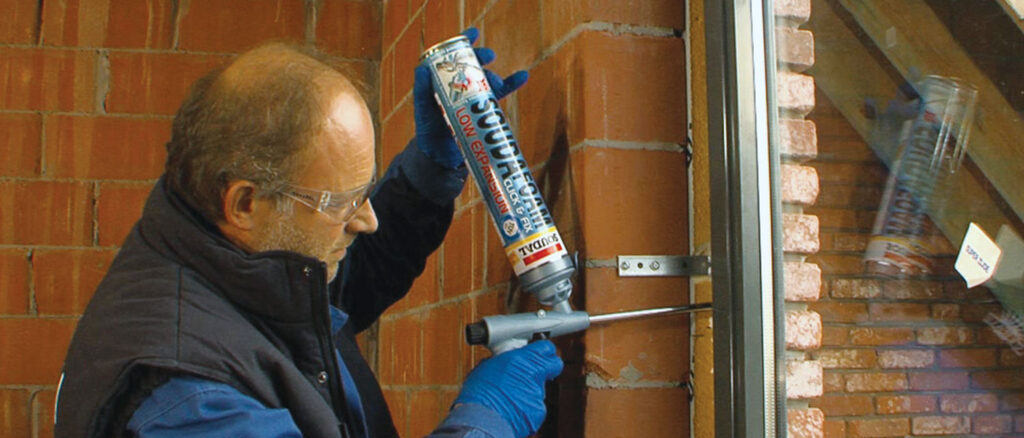 Applying gun-grade PU foam around a window frame