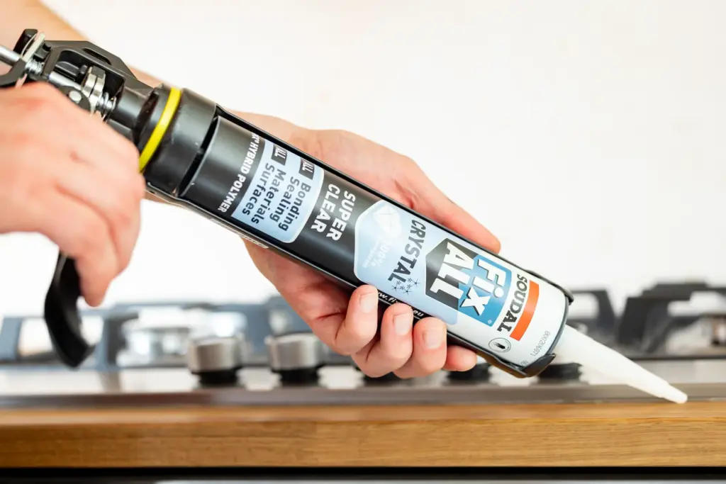 Applying Fix All Super Crystal at a kitchen worktop detail